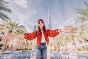 happy-indian-girl-arms-are-outstretched-as-she-embracing-incredible-view-before-her-with-unreal-burj-khalifa-tower-dubai-uae (1)