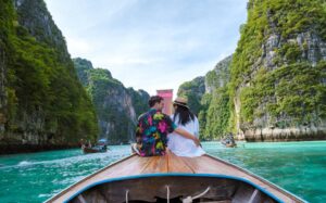 couple-front-longtail-boat-lagoon-koh-phi-phi-thailand (1)